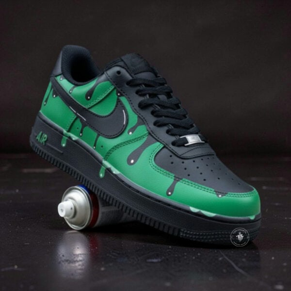 Hand-painted blue splash design on Nike Air Force 1 sneaker with black and green accents.