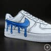 Stylish custom blue drip design on classic Air Force 1 sneakers for unique streetwear style.