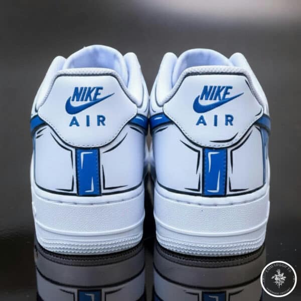 Pair of Nike Air sneakers in white and blue, perfect for casual and sportswear.