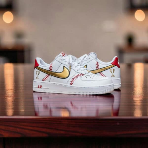 Custom baseball-themed Nike Air Force 1 sneakers with gold swoosh and red baseball stitching details.