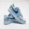 Custom hand-painted blue splash Nike Air Force 1 sneakers for unique style.