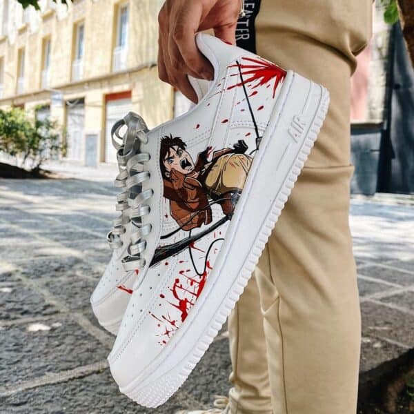 Custom Attack on Titan Air Force 1 shoes with character artwork and red paint splatters.