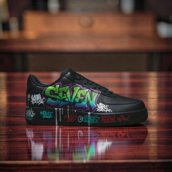 Graffiti-style custom black Air Force 1 sneakers with vibrant green, purple, and white spray paint d.