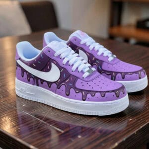 Custom hand-painted purple ice cream drip Nike AF1 sneakers with colorful sprinkles.