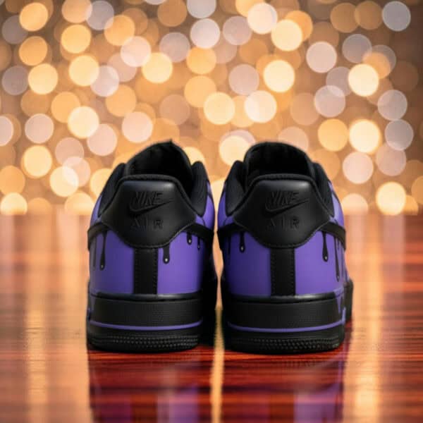 Custom purple drip Air Force 1 sneakers with black accents, stylish and unique footwear.