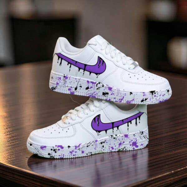 Custom purple drip design on white Air Force 1 sneakers for unique style.
