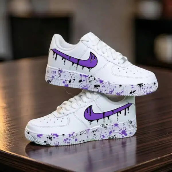 Custom purple drip design on white Air Force 1 sneakers for unique style.