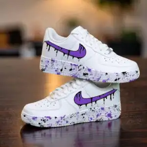Custom purple drip Nike Air Force 1 sneakers with paint splatter design. Perfect for streetwear and.