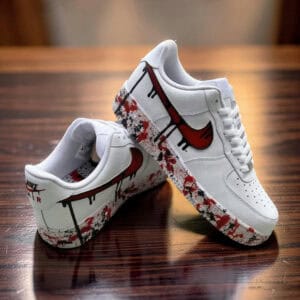 Air Force 1 sneakers with red drip paint design, custom hand-painted by KicksInk. Unique and stylish.