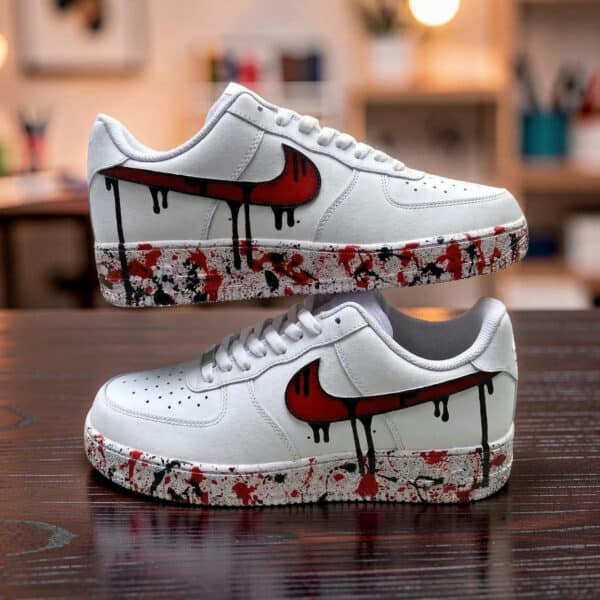 Air Force 1 sneakers with red drip paint design, custom hand-painted for a unique look.