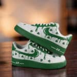Custom green drip-styled Air Force 1 sneakers with shamrocks for St. Patrick's Day. Unique, stylish,.
