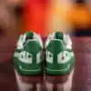 Custom green drip Nike Air Force 1 sneakers with shamrock accents for St. Patrick's Day.