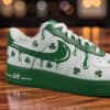 Custom green drip-styled Air Force 1 sneakers with shamrocks for St. Patrick's Day.