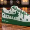 Custom green drip-styled Air Force 1 sneakers with shamrocks for St. Patrick's Day.