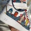 Custom Akatsuki-themed Air Force 1 sneakers with hand-painted Naruto characters. Unique, artistic fo.