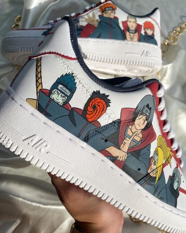 Custom Akatsuki-themed Air Force 1 sneakers with hand-painted Naruto characters. Unique, artistic fo.