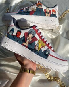 Custom Akatsuki-themed Air Force 1 sneakers with hand-painted Naruto characters. Unique, artistic fo.