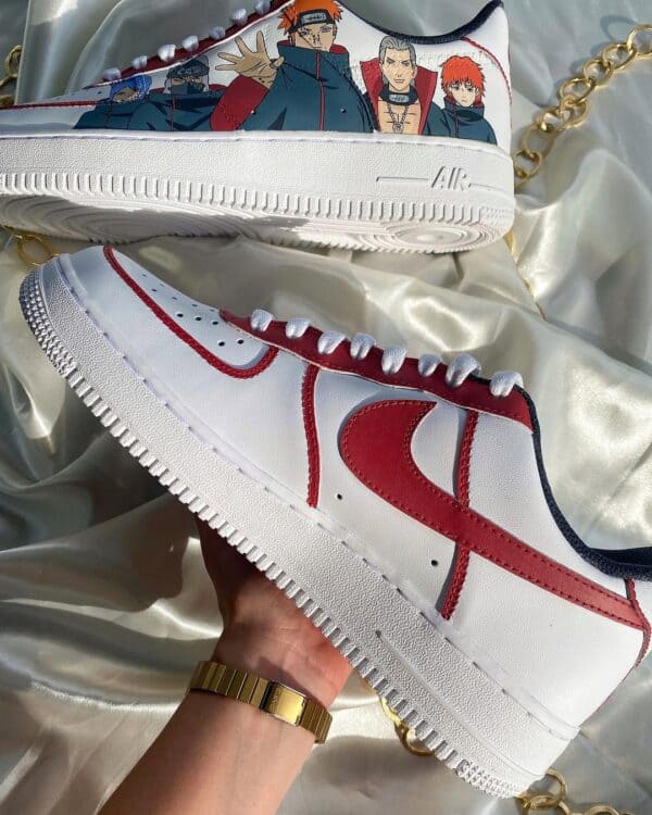 Custom Akatsuki-themed Air Force 1 sneakers with hand-painted Naruto characters. Unique sneaker art.