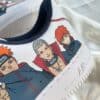 Custom Akatsuki-themed Air Force 1 sneakers with hand-painted Naruto characters. Unique footwear for.