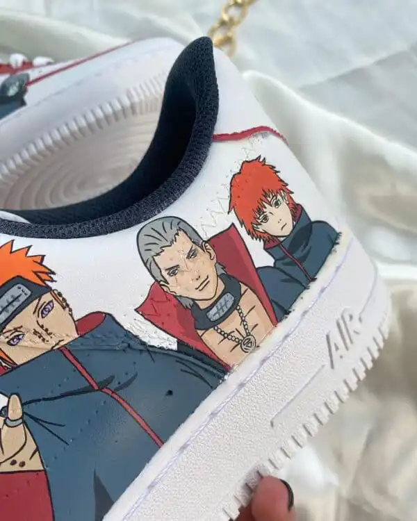 Custom Akatsuki-themed Air Force 1 sneakers with hand-painted Naruto characters. Unique footwear for.