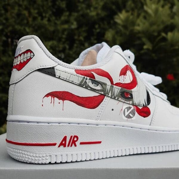 Custom painted red anime lips and teeth design on white Nike Air Force 1 sneakers.
