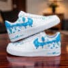 Custom white and blue Louis Vuitton-inspired AF1 sneakers with graffiti design.