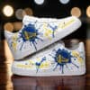 Custom Golden State Warriors sneakers with blue and yellow paint splatter design.