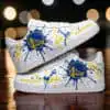 Custom Golden State Warriors sneakers with blue and yellow paint splatter design.