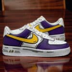 Air Force 1 sneaker with hand-painted purple and yellow comic design.