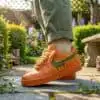 Custom hand-painted orange and green drip Air Force 1 sneakers for unique style. Perfect for sneaker.