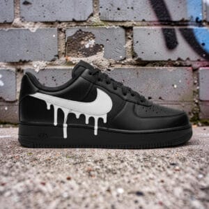 Custom White Drip Air Force 1 sneakers on black leather. Unique hand-painted design with artistic dr.