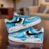Custom hand-painted blue cartoon drip Nike Air Force 1 sneakers on wooden table.
