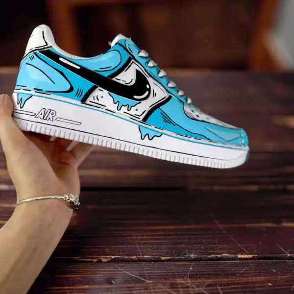 Home Custom painted blue cartoon drip Nike Air Force 1 sneakers for unique streetwear style.