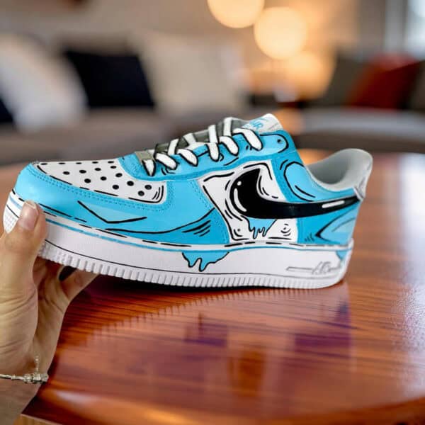 Custom hand-painted blue cartoon drip Nike AF1 sneakers with unique design.