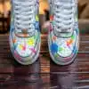 Custom Splash Air Force 1 sneakers with vibrant paint splatter design.