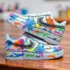 Custom hand-painted splash art on Air Force 1 sneakers with vibrant, multicolor paint splatters and.