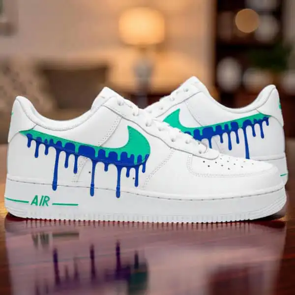 Air Force 1 sneakers with hand-painted blue jade drip design.