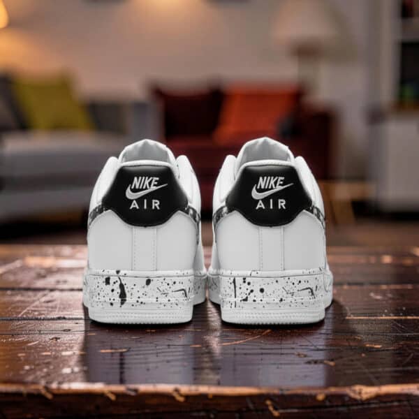 Home Custom black splash design on white Nike Air Force 1 sneakers for a unique streetwear look.