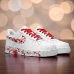 Red Splash Air Force 1 sneakers with hand-painted design and vibrant red laces. Unique custom footwe.