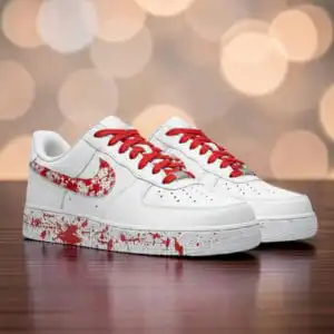 Red Splash Air Force 1 sneakers with hand-painted design and vibrant red laces. Unique custom footwe.