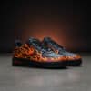 Custom hand-painted flame design on Air Force 1 sneakers with vibrant colors and detailed artwork.