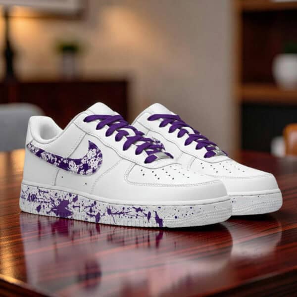 Air Force 1 sneakers with purple splash paint design, hand-painted for a unique look.