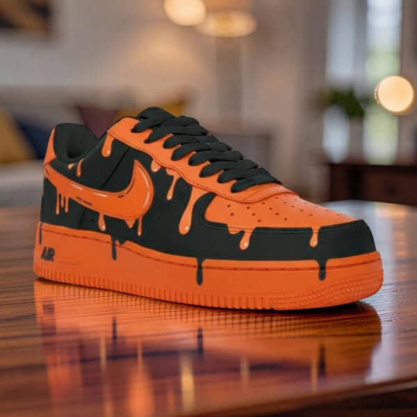 Custom orange drip Nike Air Force 1 sneakers with black accents, unique hand-painted design.