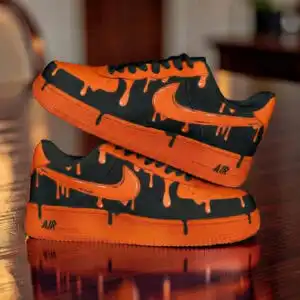 Custom painted orange drip Nike Air Force 1 sneakers for unique streetwear style.