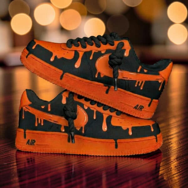 Custom Orange Drip Air Force 1 Sneakers Custom orange and black drip design Air Force 1 sneakers for unique street style.