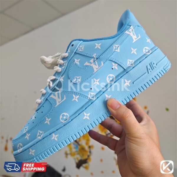 Blue custom sneakers with white print.